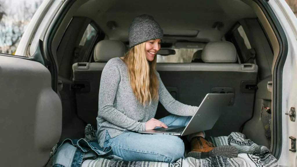 A woman working out of her vehicle.