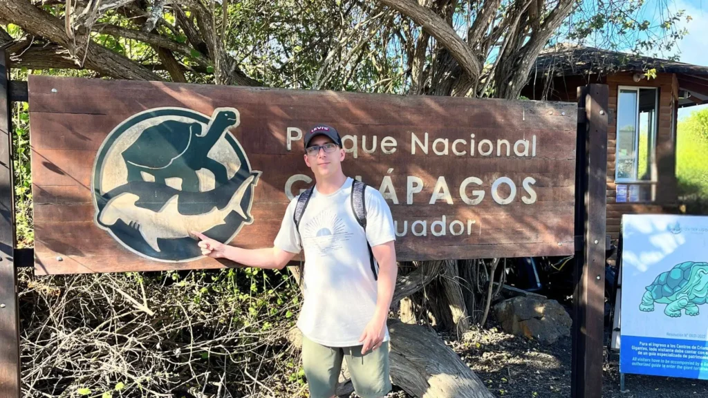 Michael at the entrance of the Galapagos National Park in Ecuador.
